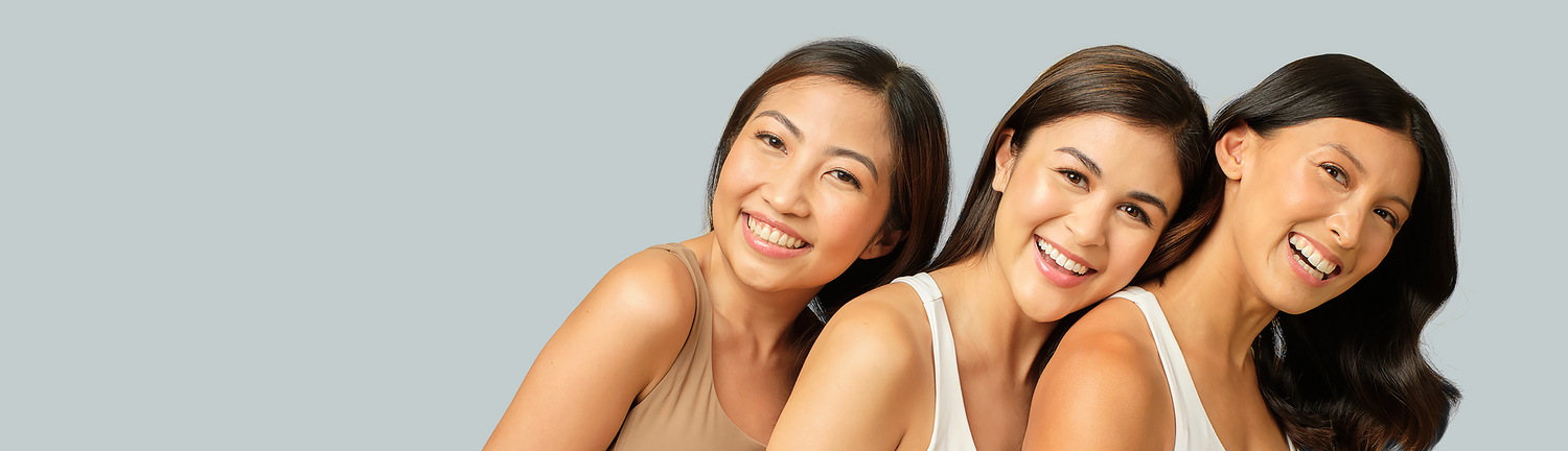 Women smiling, enjoying facial treatment in the Philippines.