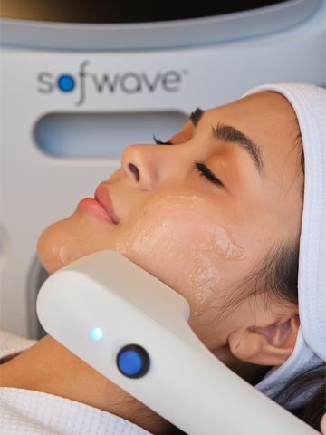 Woman enjoying her Sofwave treatment